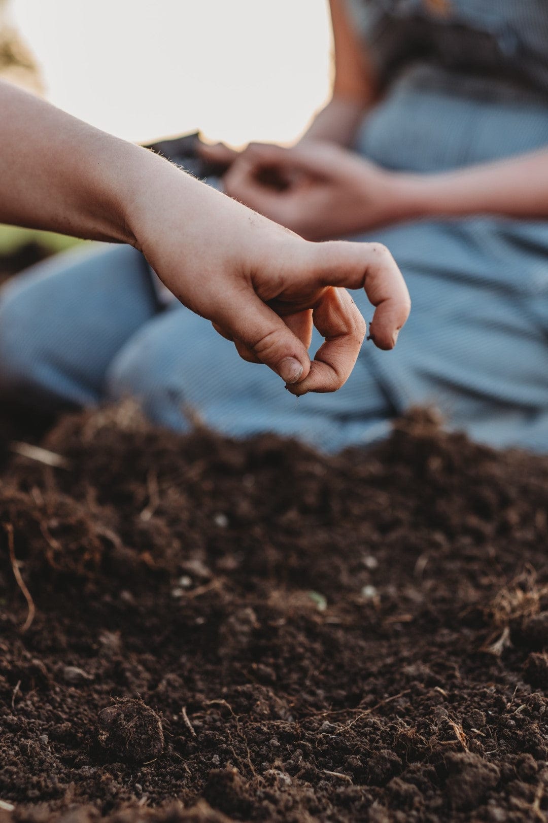 Child planting a seed