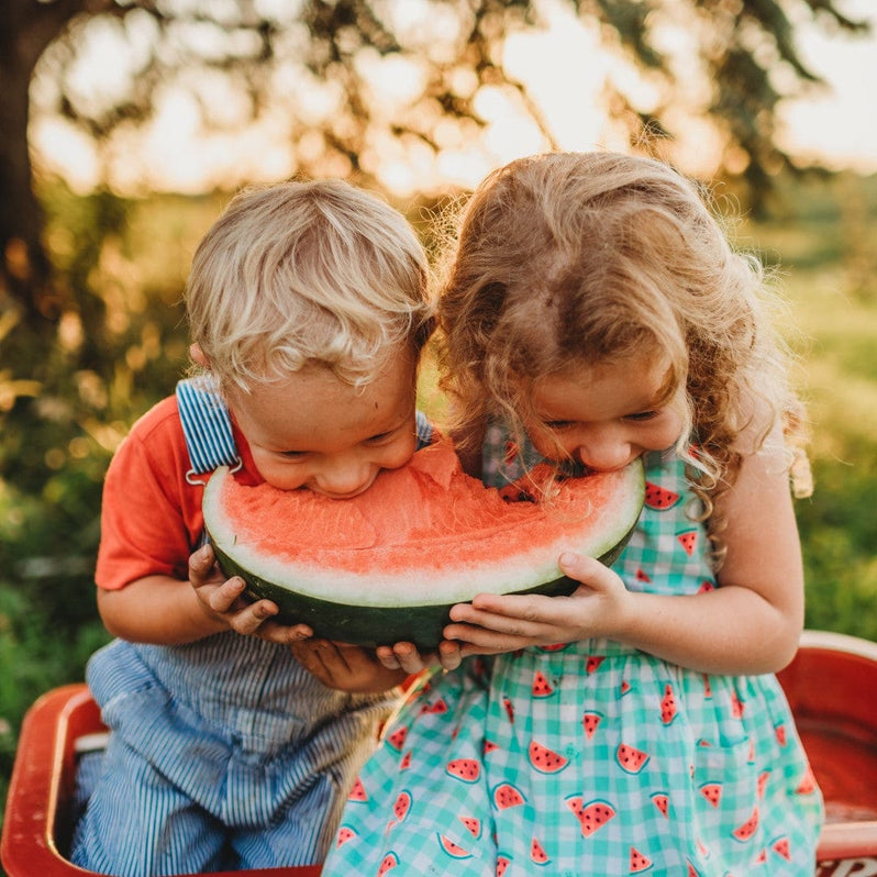 Kids eating watermelon